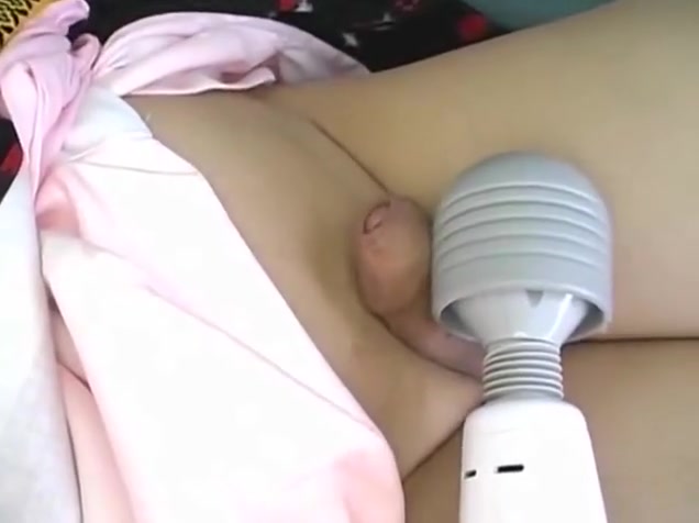 Asian ladyboy plays with vibrator