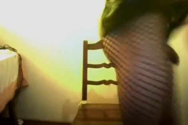 Sonia Crossdresser in pvc skirt with 2 dildos