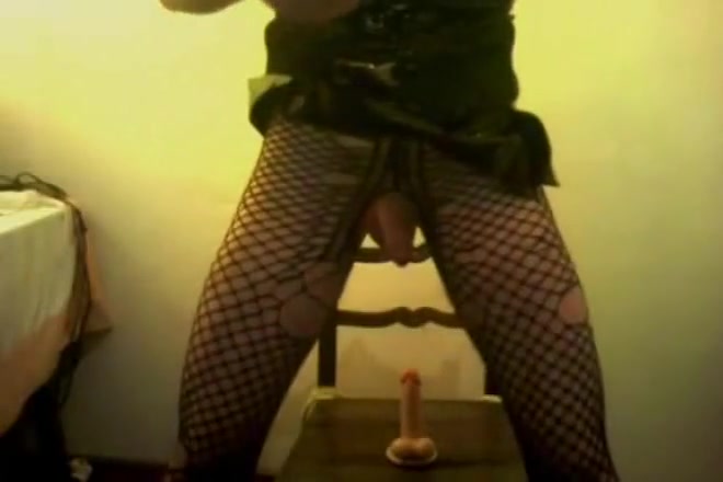 Sonia Crossdresser in pvc skirt with 2 dildos