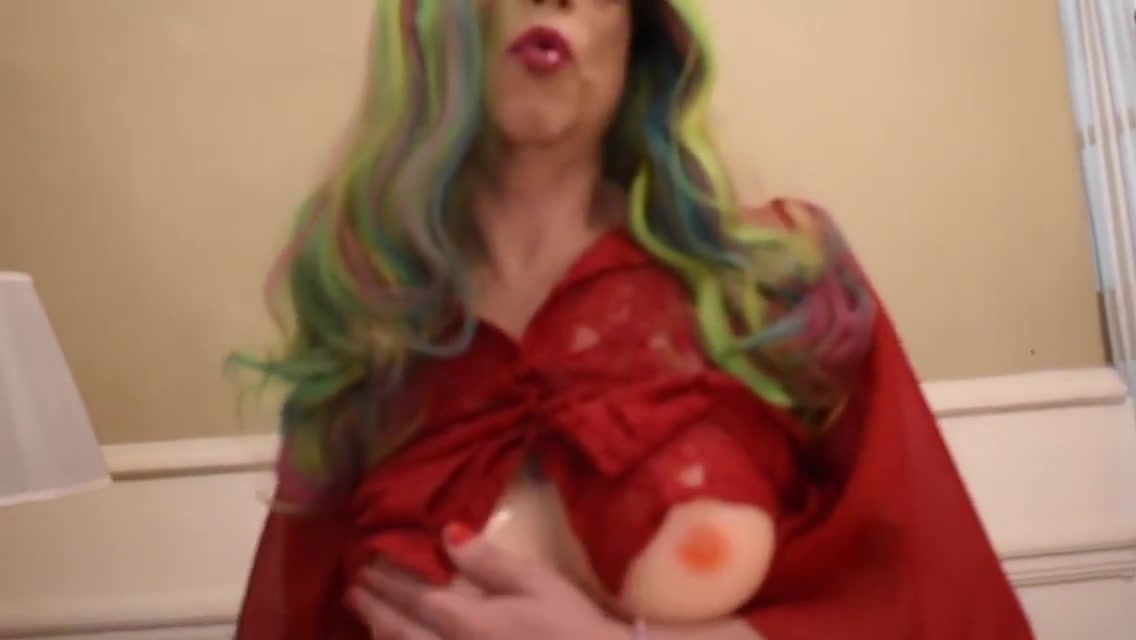 Alexia cross-dresser in red and colour wig put dildo an jerk off near the bed