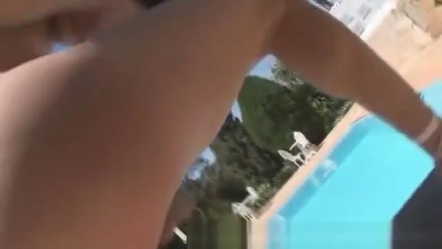 Skinny shemale with a thick uncut pipe by the pool