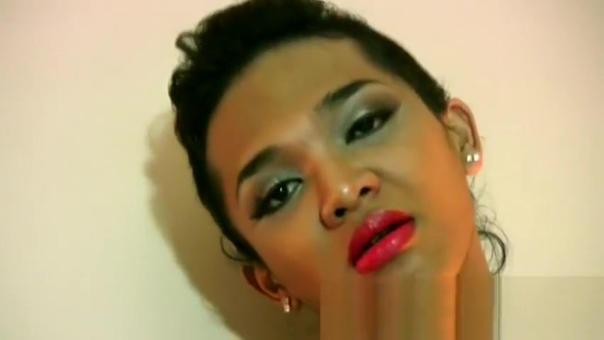 Ladyboy with big lips slips out of swimsuit and masturbates