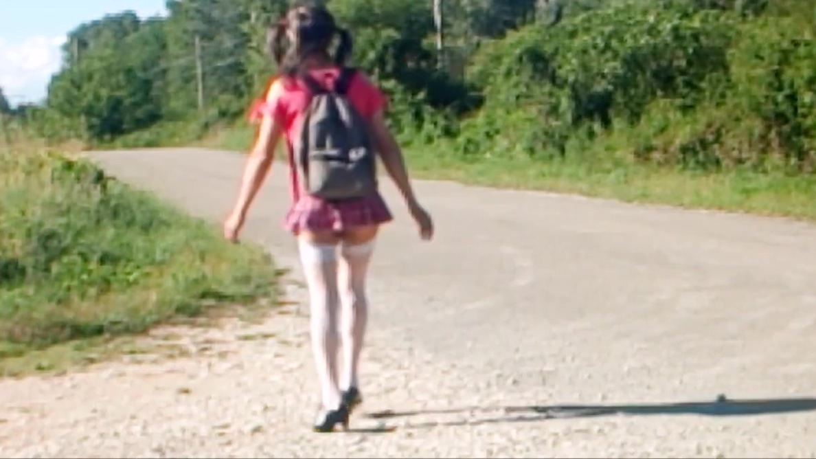 shool girl aurelia waitinb busstop station