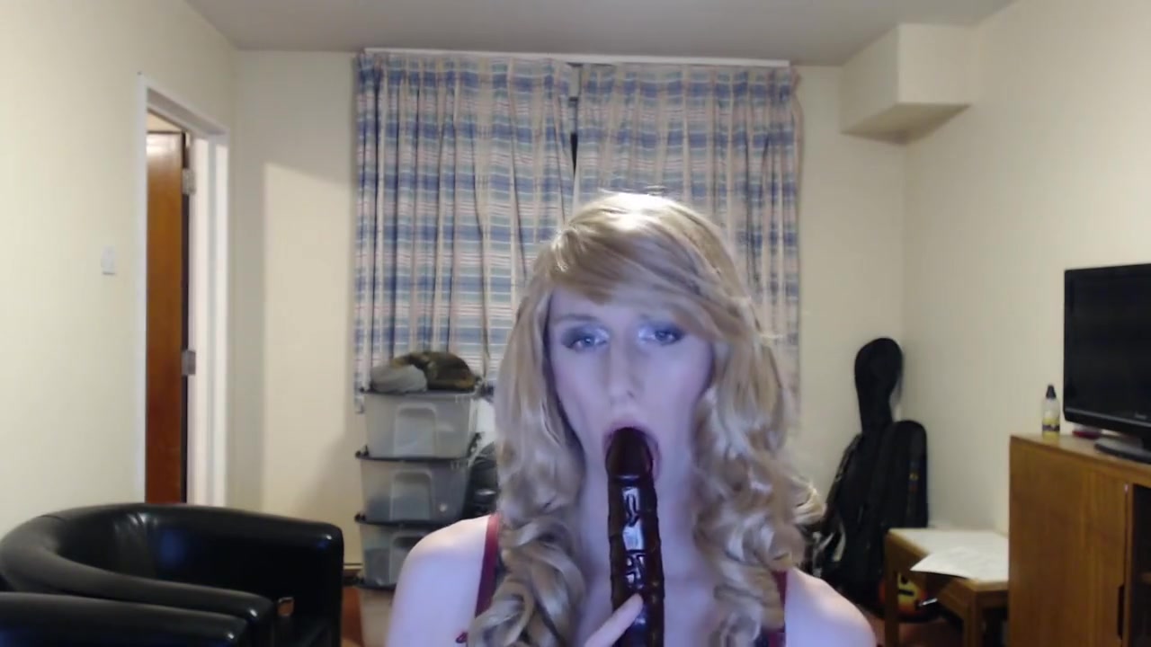 Sissy crossdresser sucks a dildo and fucks her ass