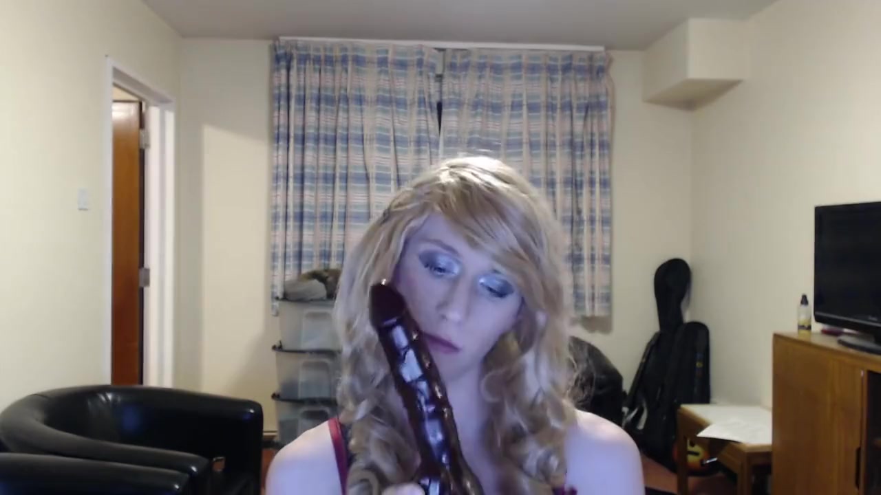 Sissy crossdresser sucks a dildo and fucks her ass