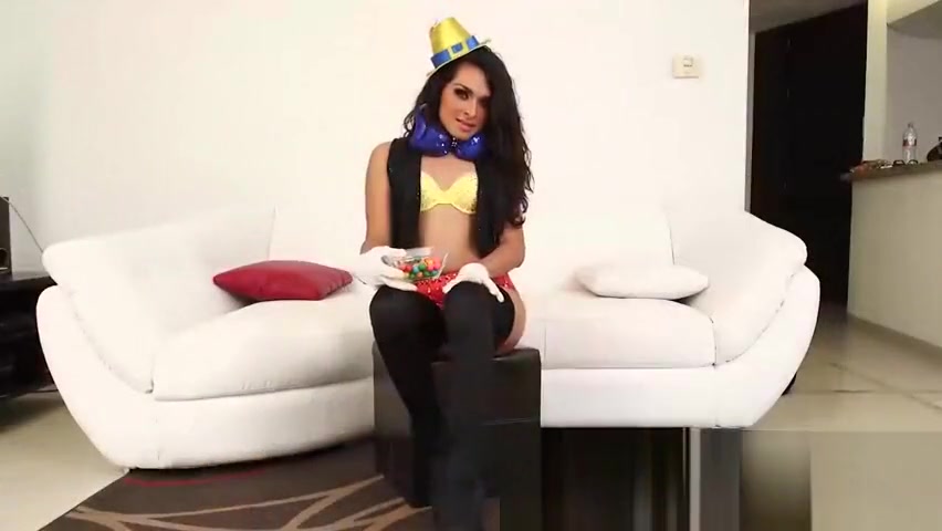 Attractive transsexual Shaidel masturbates on a white sofa
