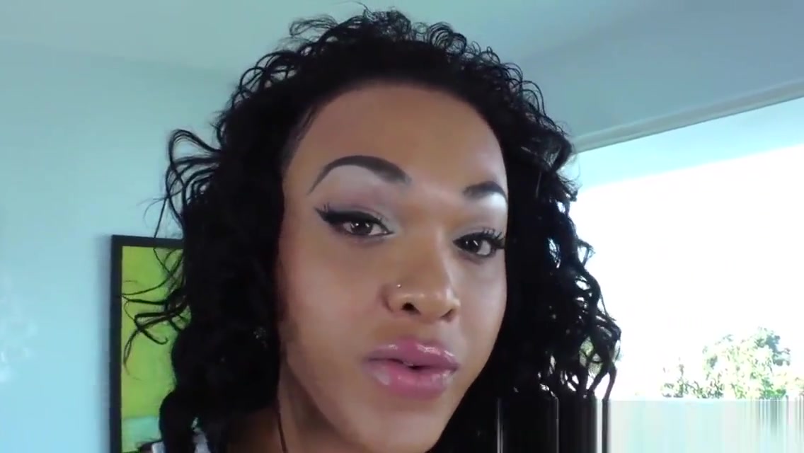 Busty black ts wanks her pierced cock