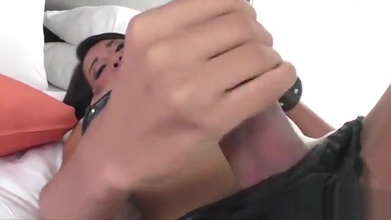 Asian tranny Candy is doing a horny pose in the front of the camera