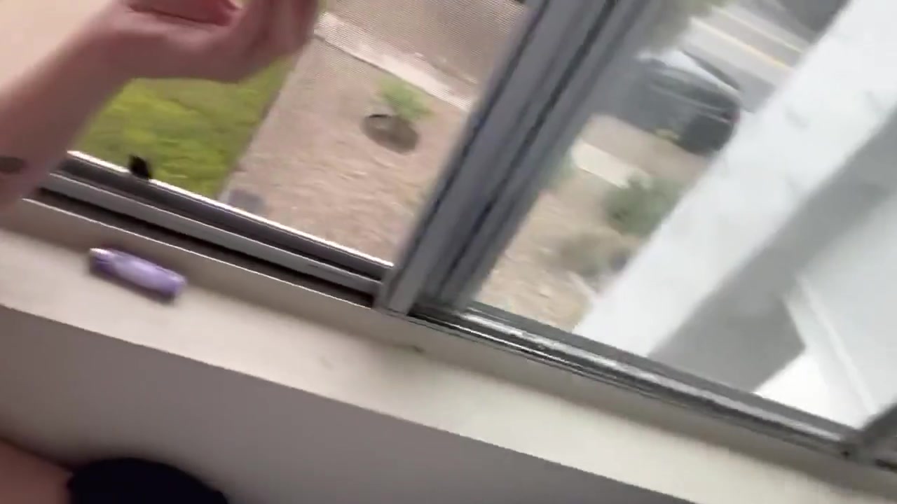 Smoking At The Window While Neighbors Are Outside