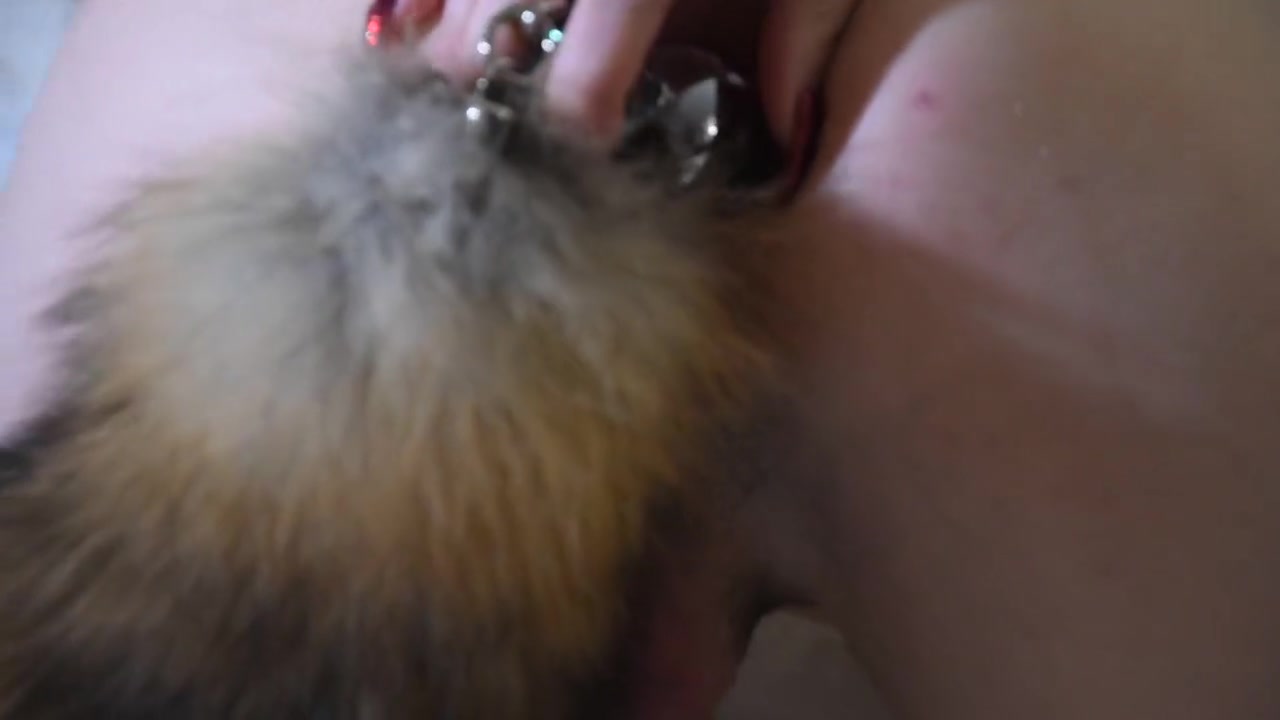 Seanna Tate Plays With Her Fox Tail