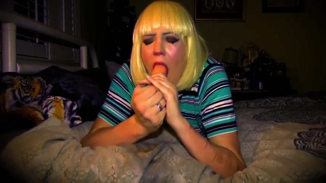 Blonde Tgirl Deepthroats Dildo