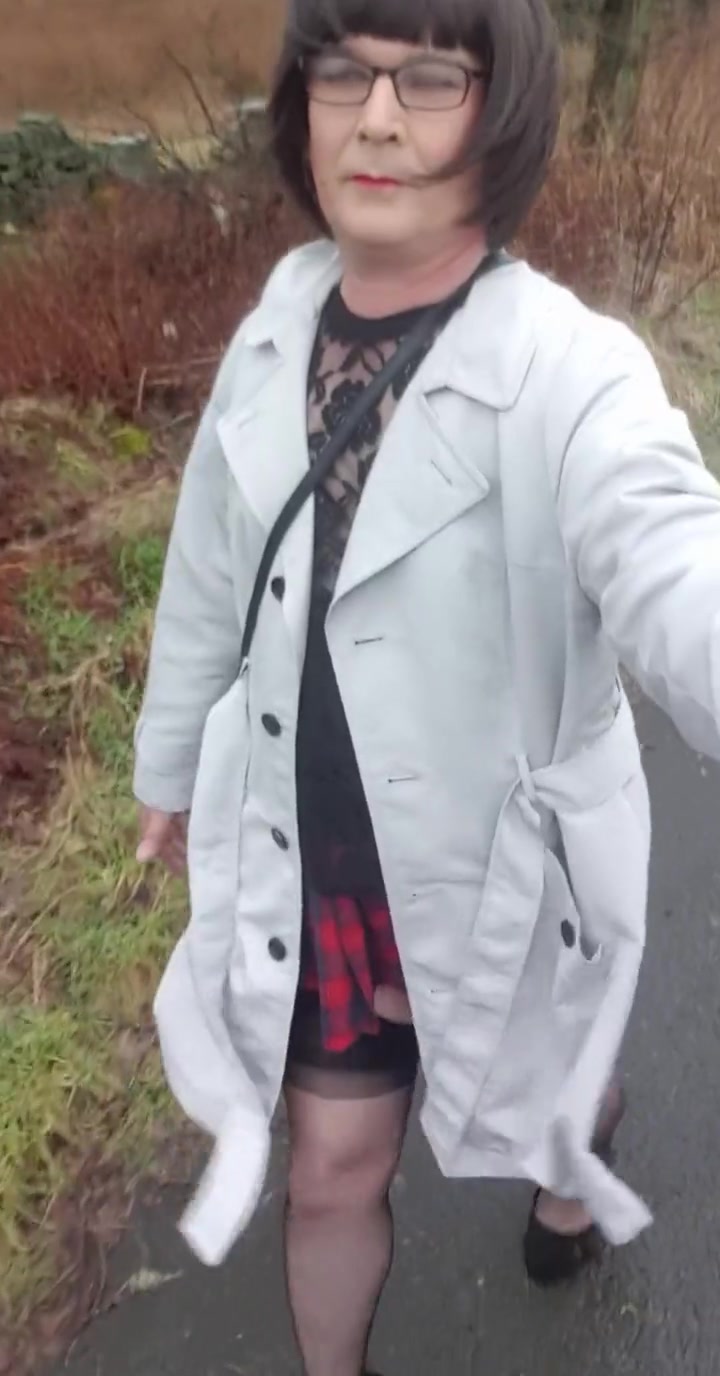 Crossdresser Takes A Walk On A Windy Lane