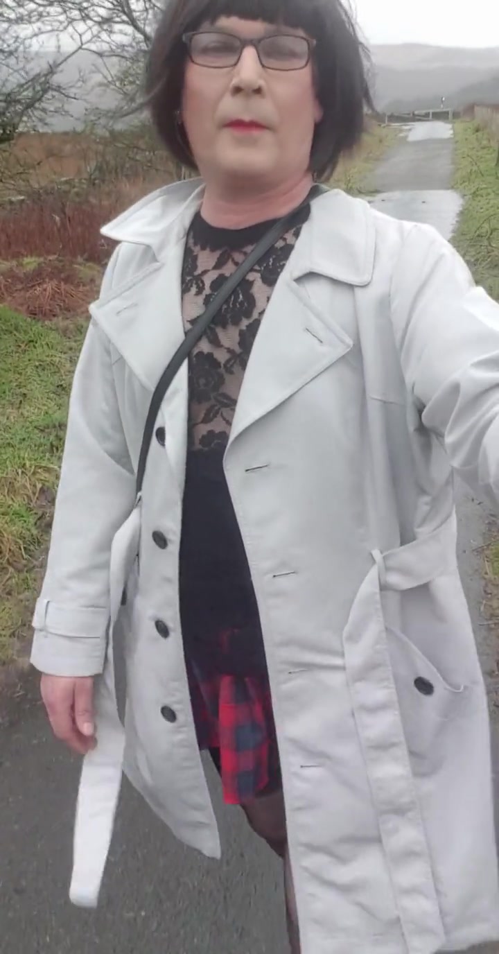 Crossdresser Takes A Walk On A Windy Lane