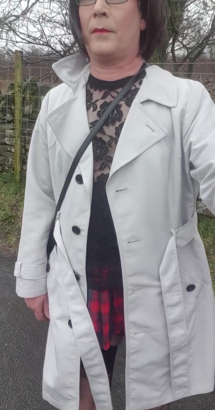 Crossdresser Takes A Walk On A Windy Lane