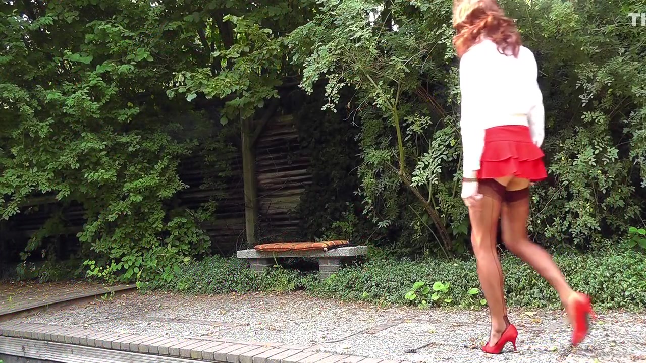 Fuckable Bum In A Red Miniskirt And Nylon Stockings