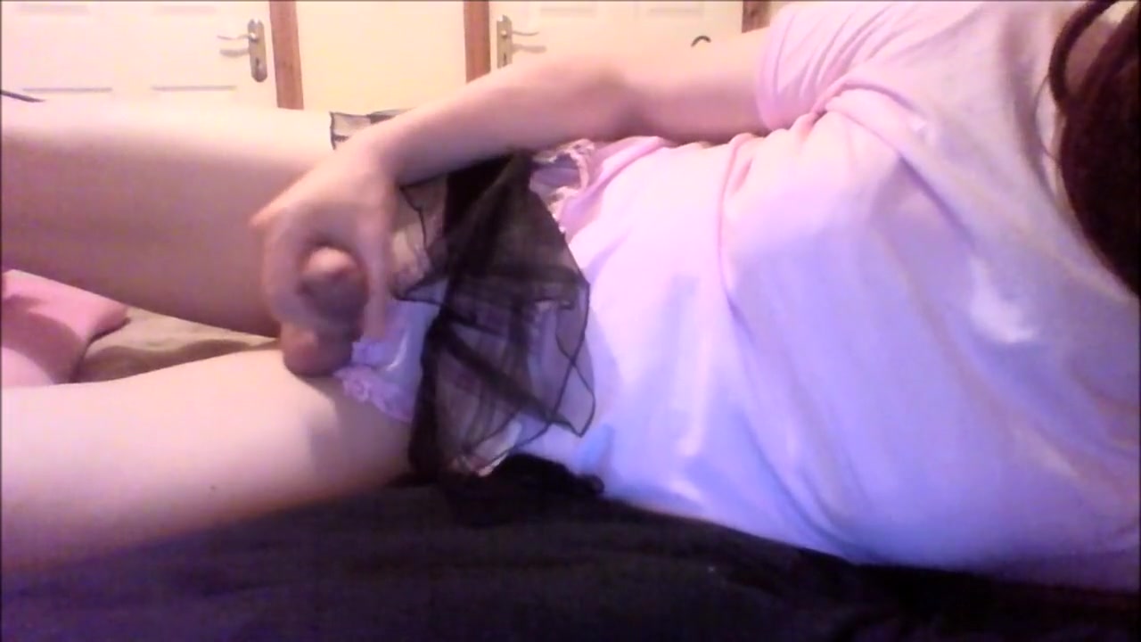Crossdresser plays with cock and cums