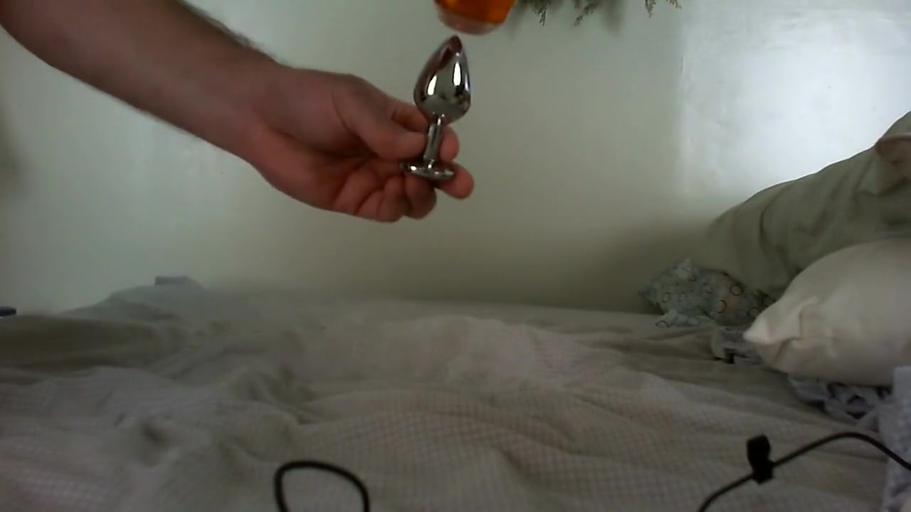 Sissy inserts butt plug and cums