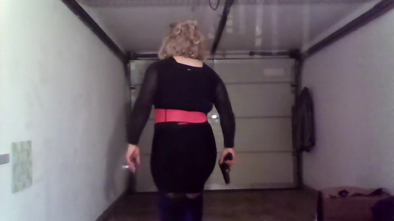 Crossdresser with black and pink boots