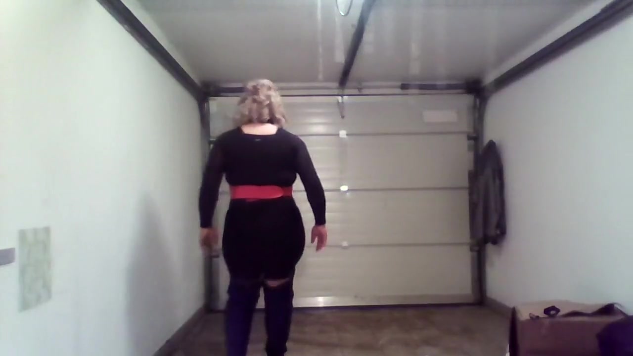 Crossdresser with black and pink boots
