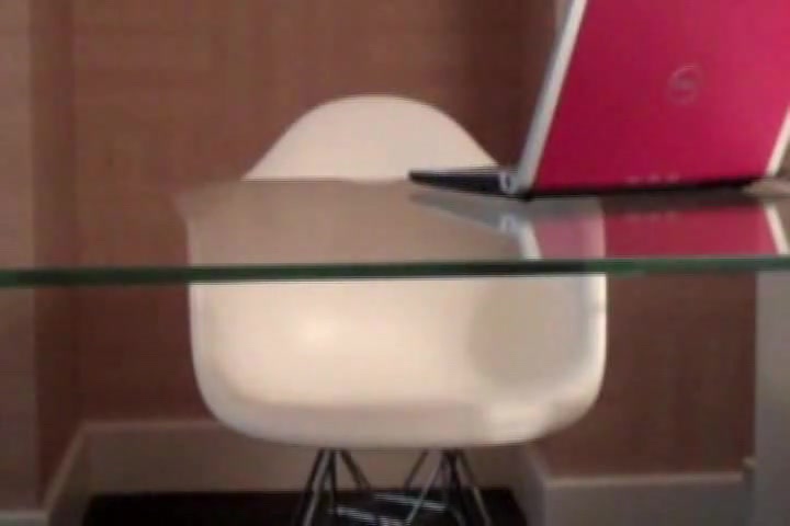 Shemale masturbates under the glass table