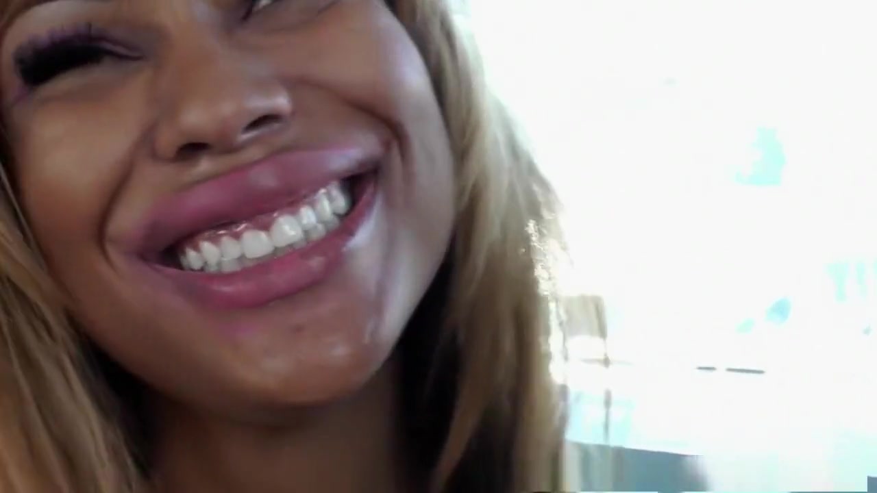 Black tranny stimulates masturbating tgirl ass with toy