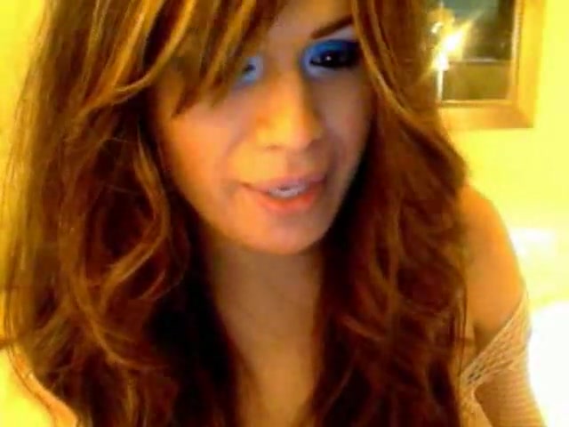 Busty TS in fishnet jerks by webcam