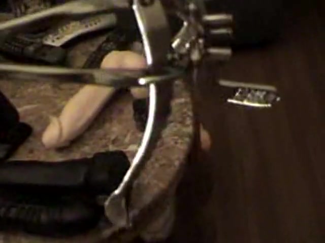 Heeled crossdresser playing with sex toys