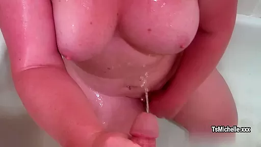 Huge tranny Michelle Austing gets urine on her tits after blowing dick