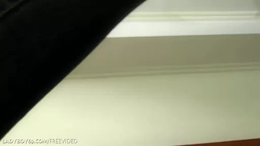 Dark-haired ladyboy with belly piercing enjoys solo masturbation on sofa