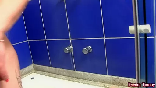Shemale trying to make a dildo fit in the shower