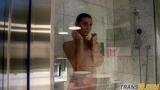 Smalltitted tranny showering while filmed