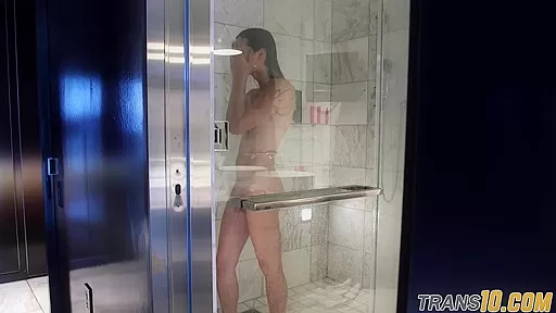 Smalltitted tranny showering while filmed