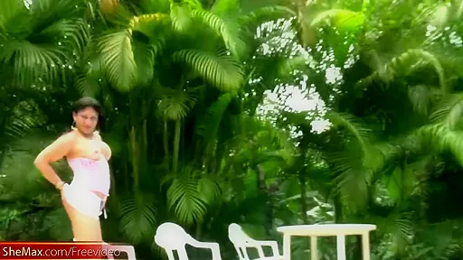 Black hair shedoll in miniskirt strips and teases poolside
