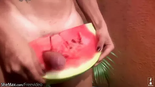Lovely shemale pounds a watermelon so hard that she cumshots