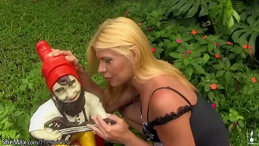 Naughty blonde shemale exposes tiny tits and penis outdoors