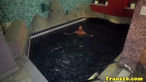 Spex trans in a bikini plays with her bigtits