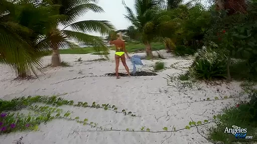Sexy blonde babe taking off her bikini at the beach