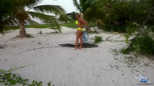 Sexy blonde babe taking off her bikini at the beach