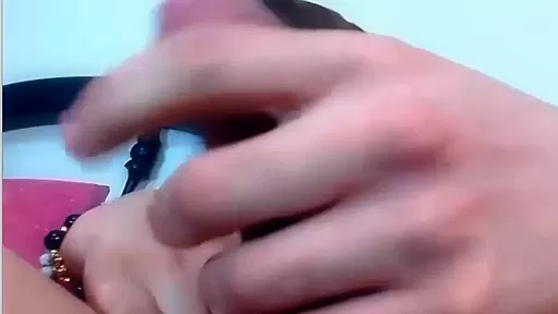 Shemale stroking her cock on the bed POV video