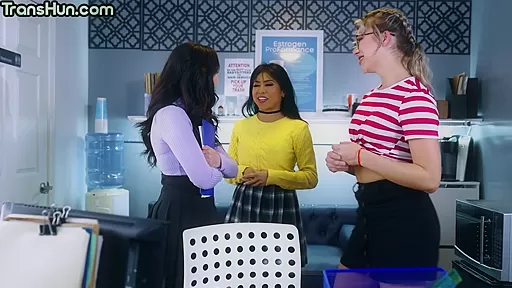 Trans goddess pussyeating office babe in front of a crowd