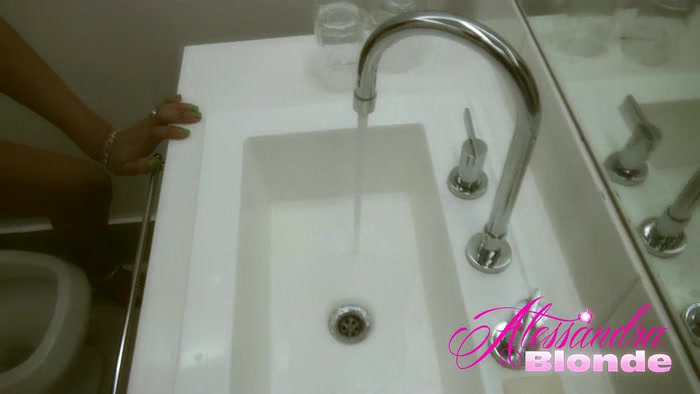 Lovely SHEMALE strokes her cock on the toilet
